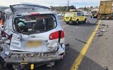 A car crushed after it was hit by a truck along Route 77, near the Kidmat Galil Industrial park in northern Israel, November 21, 2022. (Magen David Adom)