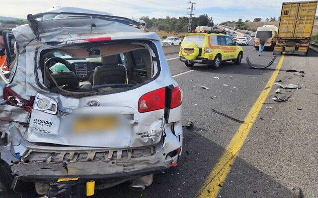 A car crushed after it was hit by a truck along Route 77, near the Kidmat Galil Industrial park in northern Israel, November 21, 2022. (Magen David Adom) A car crushed after it was hit by a truck along Route 77, near the Kidmat Galil Industrial park in northern Israel, November 21, 2022. (Magen David Adom)