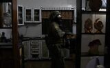 Israeli troops measure the home of Younis Hilan, accused of stabbing an Israeli man to death in October, in the West Bank village of Hajjah on November 15, 2022. (Israel Defense Forces)