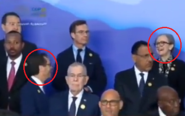 President Isaac Herzog,left, is seen briefly chatting amicably with Tunisia’s Prime Minister Najla Bouden, right, during the world leaders’ photograph at the COP27 in Egypt, November 7, 2022. (Twitter: used in accordance with Clause 27a of the Copyright Law) President Isaac Herzog,left, is seen briefly chatting amicably with Tunisia’s Prime Minister Najla Bouden, right, during the world leaders’ photograph at the COP27 in Egypt, November 7, 2022. (Twitter: used in accordance with Clause 27a of the Copyright Law)