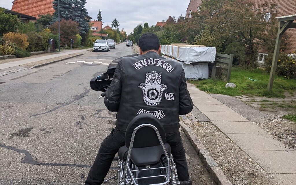 Said Idrissi, MuJu & Co.’s road captain, plans the route for the weekly Saturday ride on October 15, 2022, from Copenhagen to Hundested. (Melanie Lidman)
