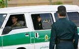 In this file photo taken on July 23, 2007, an Iranian policewoman looks on from the back of a police vehicle before the start of a crackdown to enforce Islamic dress code in the capital Tehran. (Behrouz MEHRI/AFP)