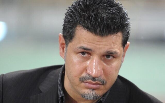 Then Iran national team coach Ali Daei watches a match against Thailand in the 2011 Asian Cup qualifier at Rajamangala stadium in Bangkok, January 28, 2009. (PORNCHAI KITTIWONGSAKUL / AFP) Then Iran national team coach Ali Daei watches a match against Thailand in the 2011 Asian Cup qualifier at Rajamangala stadium in Bangkok, January 28, 2009. (PORNCHAI KITTIWONGSAKUL / AFP)