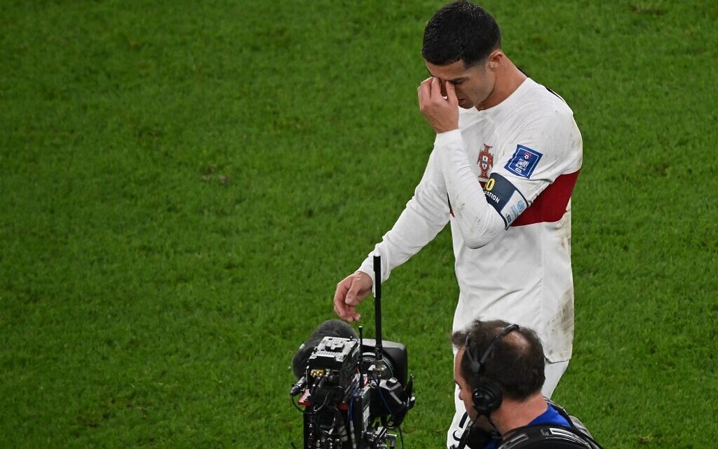 Portugal's forward Cristiano Ronaldo leaves the field after losing to Morocco 1-0 in the Qatar 2022 World Cup quarter-final soccer match at the Al-Thumama Stadium in Doha on December 10, 2022. (NELSON ALMEIDA / AFP)
