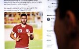 A person in the Cypriot capital Nicosia checks a tweet on December 13, 2022, by the International Federation of Professional Footballers (FIFPRO) regarding the reported risk of Iranian soccer player Amir Nasr-Azadani being sentenced to death in connection with recent protests that have shaken Iran. (AFP)
