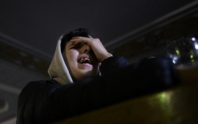 A Moroccan fan reacts after watching a live broadcast of the Qatar 2022 World Cup semifinals soccer match between France and Morocco, at a bar in Madrid, on December 14, 2022. (Oscar Del Pozo/AFP) A Moroccan fan reacts after watching a live broadcast of the Qatar 2022 World Cup semifinals soccer match between France and Morocco, at a bar in Madrid, on December 14, 2022. (Oscar Del Pozo/AFP)