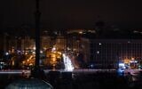 This photograph taken with a long exposure shows car lights near the Maidan Square during a power outage in the city of Kyiv, on December 17, 2022, amid the Russian invasion of Ukraine. (Sameer Al-DOUMY/AFP)