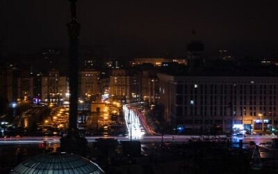 This photograph taken with a long exposure shows car lights near the Maidan Square during a power outage in the city of Kyiv, on December 17, 2022, amid the Russian invasion of Ukraine. (Sameer Al-DOUMY/AFP)
