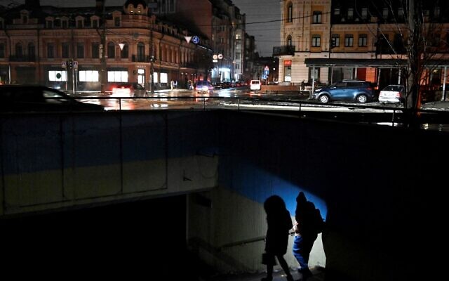 People use a flashlight as they enter an underground passage during a blackout following Russian strikes on the power infrastructure in Kyiv on December 17, 2022, amid the Russian invasion of Ukraine. (Sergei CHUZAVKOV / AFP) People use a flashlight as they enter an underground passage during a blackout following Russian strikes on the power infrastructure in Kyiv on December 17, 2022, amid the Russian invasion of Ukraine. (Sergei CHUZAVKOV / AFP)