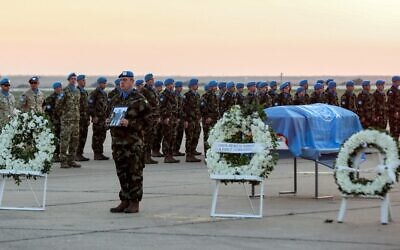 UNIFIL peacekeepers attend a repatriation ceremony for Irish soldier Sean Rooney who was killed on a UN patrol, at Beirut, Lebanon's international airport, on December 18, 2022. (Anwar Amro/AFP)