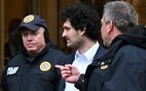 FTX founder Sam Bankman-Fried leaves court following his arraignment in New York City on December 22, 2022. (Photo by Ed Jones/AFP)