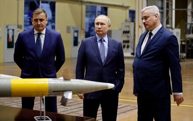 Russia's President Vladimir Putin (C), flanked by Tula's Region Governor Alexei Dyumin (L), listens to explanations from Shcheglovsky Val Director General Alexei Visloguzov (R) as he visits the Shcheglovsky Val machine building plant, a subsidiary of KBP Instrument Design Bureau, in Tula, Russia, on December 23, 2022. Russia's President Vladimir Putin (C), flanked by Tula's Region Governor Alexei Dyumin (L), listens to explanations from Shcheglovsky Val Director General Alexei Visloguzov (R) as he visits the Shcheglovsky Val machine building plant, a subsidiary of KBP Instrument Design Bureau, in Tula, Russia, on December 23, 2022.