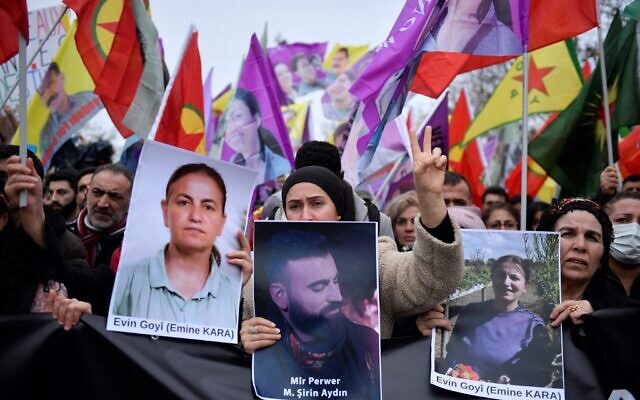 Supporters and members of the Kurdish community hold portraits of victims Emine Kara and Mir Perwer during a demonstration a day after a gunman opened fire at a Kurdish cultural centre killing three people, at The Place de la Republique in Paris on December 24, 2022. (Photo by JULIEN DE ROSA / AFP) Supporters and members of the Kurdish community hold portraits of victims Emine Kara and Mir Perwer during a demonstration a day after a gunman opened fire at a Kurdish cultural centre killing three people, at The Place de la Republique in Paris on December 24, 2022. (Photo by JULIEN DE ROSA / AFP)