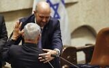 New Knesset Speaker Amir Ohana (top) and new Prime Minister Benjamin Netanyahu congratulate each other as the new government is sworn in, in Jerusalem, December 29, 2022. (Amir Cohen/Pool/AFP)