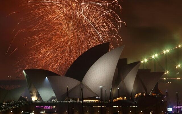 The 'family fireworks' displayed three hours before midnight every year ahead of the main show at midnight, fill the sky over the Opera House in Sydney on New Year's Eve on December 31, 2022. (David Gray/AFP) The 'family fireworks' displayed three hours before midnight every year ahead of the main show at midnight, fill the sky over the Opera House in Sydney on New Year's Eve on December 31, 2022. (David Gray/AFP)