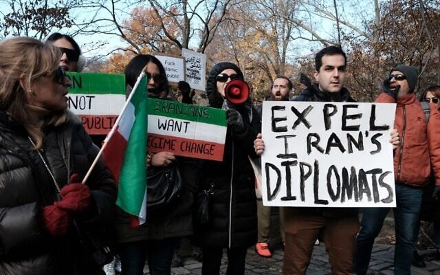 Illustrative: People gather outside of an Iranian diplomat's residence to denounce the Iranian government and the recent execution of a protester on December 10, 2022, in New York City (SPENCER PLATT / Getty Images via AFP) Illustrative: People gather outside of an Iranian diplomat's residence to denounce the Iranian government and the recent execution of a protester on December 10, 2022, in New York City (SPENCER PLATT / Getty Images via AFP)