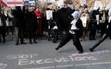 People gather outside of an Iranian diplomat's residence to denounce the Iranian government and the recent execution of a protester on December 10, 2022 in New York City. (Spencer Platt/Getty Images/AFP)