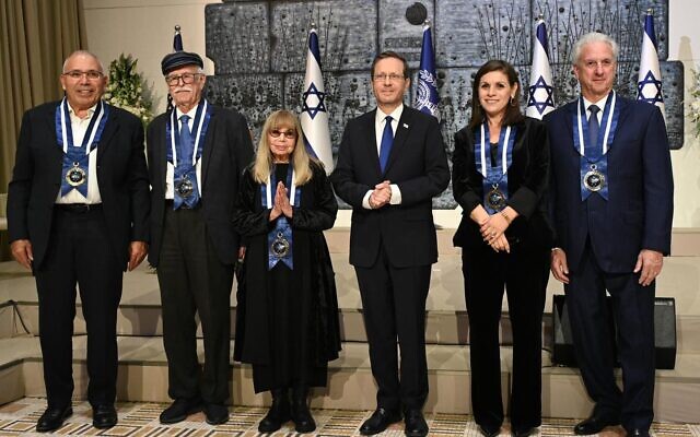 President Isaac Herzog (third from right) with the five recipients of the presidential medal of honor in Jerusalem on December 11, 2022. (Haim Zach/GPO) President Isaac Herzog (third from right) with the five recipients of the presidential medal of honor in Jerusalem on December 11, 2022. (Haim Zach/GPO)