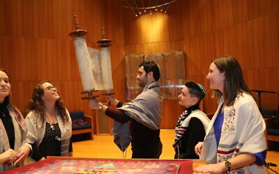 Jesse Epstein (center), a rabbinical student at Hebrew Union College, is the new owner of Shmaltz Brewing Company. (Courtesy of Jesse Epstein via JTA)