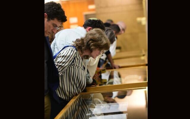 Members and descendants of Israel's Irish-Jewish community viewing items from the genealogical history of the Jewish communities of Ireland at a ceremony in Jerusalem, December 19, 2022. (Yoni Kelberman via JTA) Members and descendants of Israel's Irish-Jewish community viewing items from the genealogical history of the Jewish communities of Ireland at a ceremony in Jerusalem, December 19, 2022. (Yoni Kelberman via JTA)