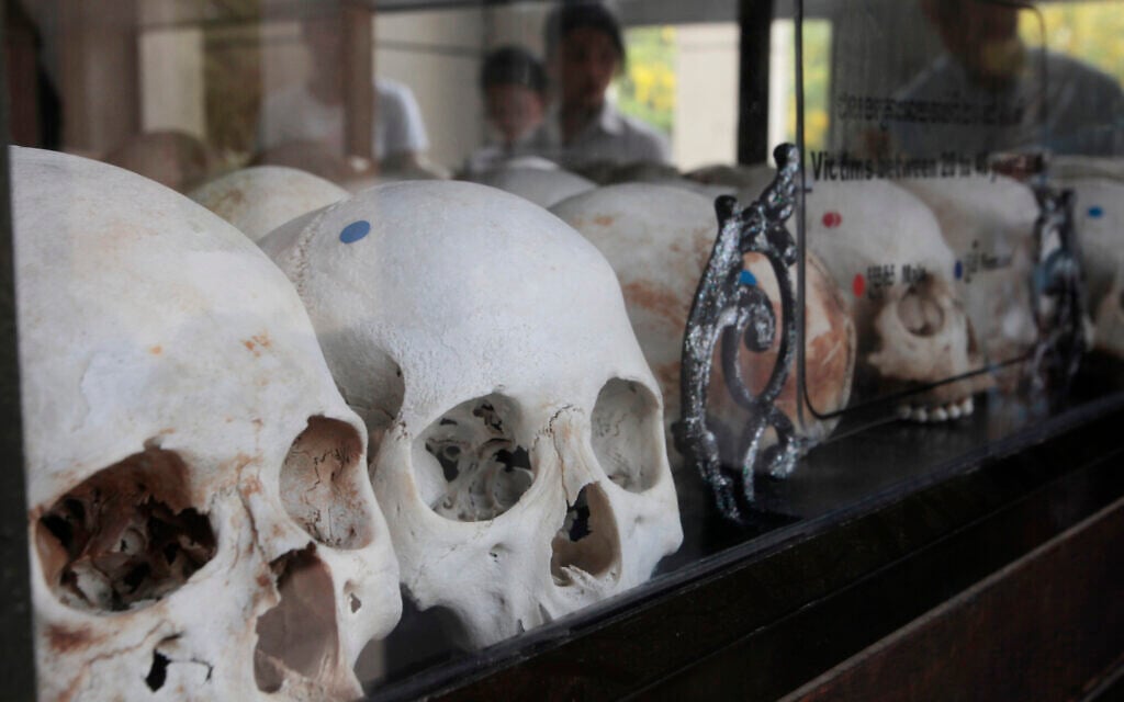 Visitors watch human skulls and bones of victims in Khmer Rouge regime on display at Choeung Ek memorial outside Phnom Penh, Cambodia, April 17, 2017. (AP Photo/Heng Sinith) Visitors watch human skulls and bones of victims in Khmer Rouge regime on display at Choeung Ek memorial outside Phnom Penh, Cambodia, April 17, 2017. (AP Photo/Heng Sinith)