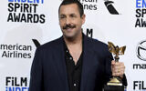 Adam Sandler poses in the press room with the award for best male lead for "Uncut Gems at the 35th Film Independent Spirit Awards on Saturday, Feb. 8, 2020, in Santa Monica, Calif. (Photo by Richard Shotwell/Invision/AP)
