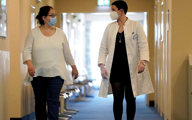 Illustrative image: A patient (left) and a doctor in Heiligendamm, northern Germany, at one of many clinics around the world that specialises in care and rehab for people with long COVID, April 14, 2021. (AP Photo/Michael Sohn) Illustrative image: A patient (left) and a doctor in Heiligendamm, northern Germany, at one of many clinics around the world that specialises in care and rehab for people with long COVID, April 14, 2021. (AP Photo/Michael Sohn)