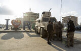 Illustrative: US-backed Syrian Democratic Forces (SDF) fighters stand guard at Al Naeem Square, in Raqqa, Syria, February 7, 2022. (AP Photo/Baderkhan Ahmad)
