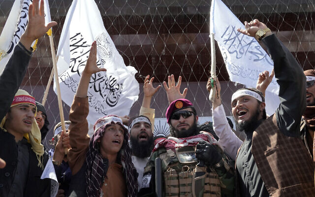 Taliban fighters chant slogans during a celebration marking the first anniversary of the withdrawal of US-led troops from Afghanistan, in front of the US Embassy in Kabul, Afghanistan, August 31, 2022. (AP Photo/Ebrahim Noroozi) Taliban fighters chant slogans during a celebration marking the first anniversary of the withdrawal of US-led troops from Afghanistan, in front of the US Embassy in Kabul, Afghanistan, August 31, 2022. (AP Photo/Ebrahim Noroozi)