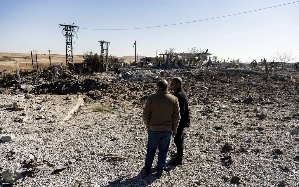 File: People look at a site damaged by Turkish airstrikes that hit an electricity station in the village of Taql Baql, in Hasakeh province, Syria, Sunday, Nov. 20, 2022 (AP Photo/Baderkhan Ahmad, File) File: People look at a site damaged by Turkish airstrikes that hit an electricity station in the village of Taql Baql, in Hasakeh province, Syria, Sunday, Nov. 20, 2022 (AP Photo/Baderkhan Ahmad, File)