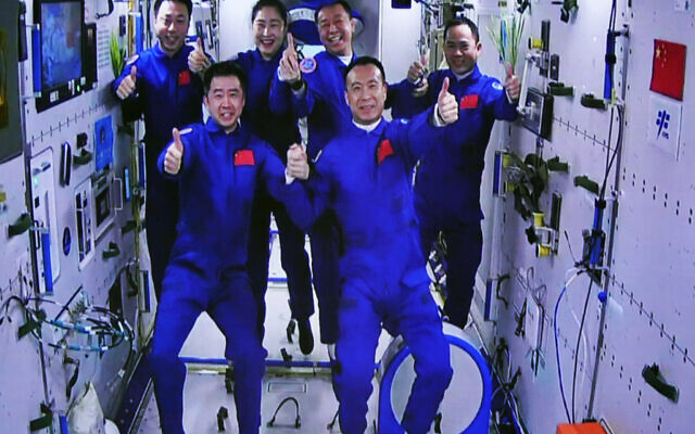 The Shenzhou-15 and Shenzhou-14 crew take a group picture with their thumbs up after a historic gathering in space on Nov. 30, 2022. (Guo Zhongzheng/Xinhua News Agency via AP) The Shenzhou-15 and Shenzhou-14 crew take a group picture with their thumbs up after a historic gathering in space on Nov. 30, 2022. (Guo Zhongzheng/Xinhua News Agency via AP)