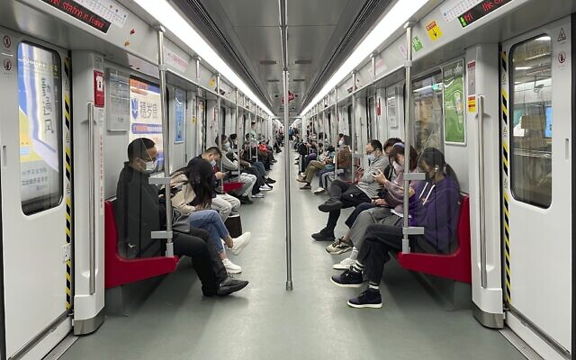 Residents ride public transport in the district of Haizhu as pandemic restrictions are eased in southern China's Guangzhou province, December 1, 2022. (AP Photo) Residents ride public transport in the district of Haizhu as pandemic restrictions are eased in southern China's Guangzhou province, December 1, 2022. (AP Photo)