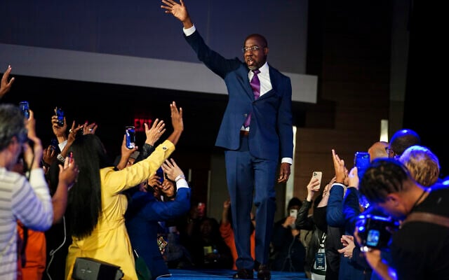 Democratic Sen. Raphael Warnock speaks during an election night watch party, Tuesday, Dec. 6, 2022, in Atlanta. Democratic Sen. Raphael Warnock has defeated Republican challenger Herschel Walker in a runoff election in Georgia. (AP/John Bazemore) Democratic Sen. Raphael Warnock speaks during an election night watch party, Tuesday, Dec. 6, 2022, in Atlanta. Democratic Sen. Raphael Warnock has defeated Republican challenger Herschel Walker in a runoff election in Georgia. (AP/John Bazemore)