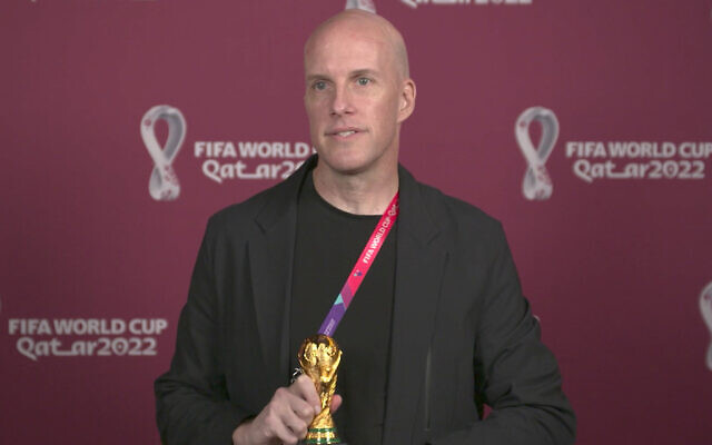 A screenshot taken from video provided by FIFA of journalist Grant Wahl at an awards ceremony in Doha, Qatar in Nov. 2022. Wahl, one of the most well-known soccer writers in the United States, died Dec. 10, 2022 while covering the World Cup match between Argentina and the Netherlands. (FIFA via AP) A screenshot taken from video provided by FIFA of journalist Grant Wahl at an awards ceremony in Doha, Qatar in Nov. 2022. Wahl, one of the most well-known soccer writers in the United States, died Dec. 10, 2022 while covering the World Cup match between Argentina and the Netherlands. (FIFA via AP)