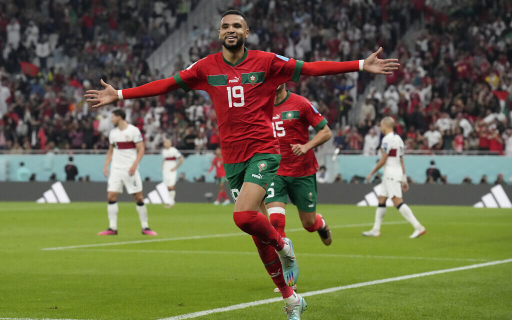 Morocco's Youssef En-Nesyri celebrates after scoring his side's first goal during the World Cup quarterfinal soccer match between Morocco and Portugal, at Al Thumama Stadium in Doha, Qatar, Saturday, December 10, 2022. (AP/Martin Meissner)