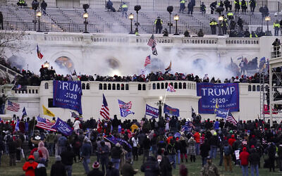 Violent rioters, loyal to US President Donald Trump, storm the Capitol in Washington, January 6, 2021. (AP Photo/John Minchillo)