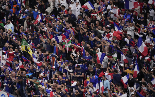 French fans celebrate their team's victory over Engand in their World Cup quarterfinal soccer match, at the Al Bayt Stadium in Al Khor, Qatar, Sunday, Dec. 11, 2022. (AP Photo/Darko Bandic) French fans celebrate their team's victory over Engand in their World Cup quarterfinal soccer match, at the Al Bayt Stadium in Al Khor, Qatar, Sunday, Dec. 11, 2022. (AP Photo/Darko Bandic)