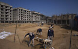 A Palestinian excavation team works in a newly discovered Roman-era cemetery in the Gaza Strip, December 11, 2022. (AP Photo/ Fatima Shbair)