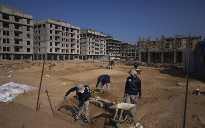 A Palestinian excavation team works in a newly discovered Roman-era cemetery in the Gaza Strip, December 11, 2022. (AP Photo/ Fatima Shbair)