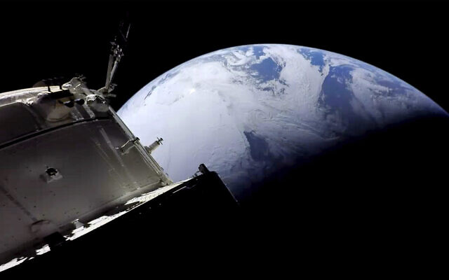 This image provided by NASA shows the Orion spacecraft approaching Earth on December 11, 2022, as it neared the end of its three-week test flight to the moon. (NASA via AP) This image provided by NASA shows the Orion spacecraft approaching Earth on December 11, 2022, as it neared the end of its three-week test flight to the moon. (NASA via AP)