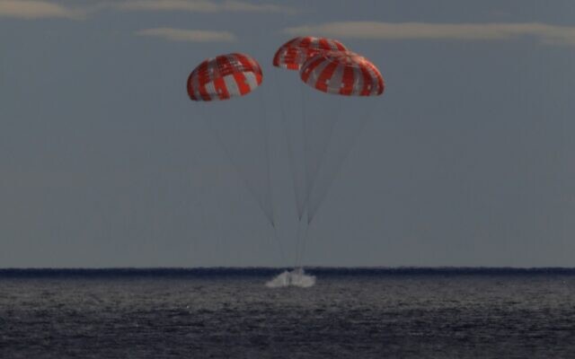 The Orion spacecraft for the Artemis I mission splashes down in the Pacific Ocean after a 25.5 day mission to the moon, December 11, 2022. (NASA via AP) The Orion spacecraft for the Artemis I mission splashes down in the Pacific Ocean after a 25.5 day mission to the moon, December 11, 2022. (NASA via AP)