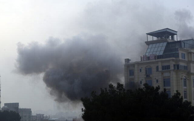 Smoke rises from a hotel building after an explosions and gunfire in the city of Kabul, Afghanistan, December 12, 2022. (AP Photo)