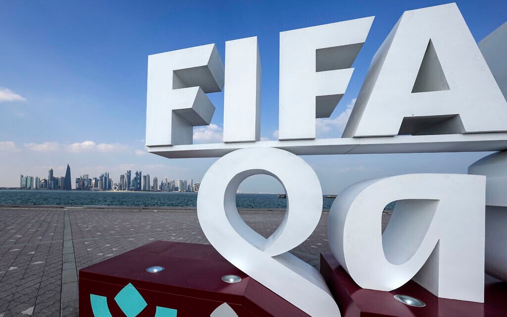 A FIFA lettering is pictured in front of the Doha skyline during the Soccer World Cup in central Doha, Qatar, on December 12, 2022. (AP Photo/Martin Meissner)