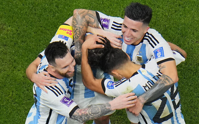 Argentina players celebrate with Argentina's Lionel Messi, left, who scored his side's first goal with a penalty shot during the World Cup semifinal soccer match between Argentina and Croatia at the Lusail Stadium in Lusail, Qatar, December 13, 2022. (AP Photo/Hassan Ammar) Argentina players celebrate with Argentina's Lionel Messi, left, who scored his side's first goal with a penalty shot during the World Cup semifinal soccer match between Argentina and Croatia at the Lusail Stadium in Lusail, Qatar, December 13, 2022. (AP Photo/Hassan Ammar)