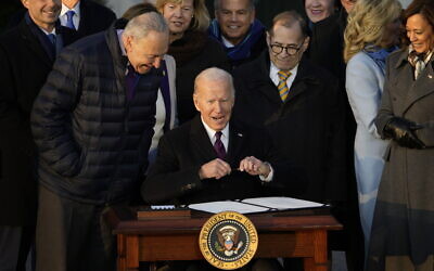 US President Joe Biden signs the Respect for Marriage Act, December 13, 2022, on the South Lawn of the White House in Washington. (AP Photo/Andrew Harnik)