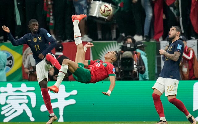 Morocco's Jawad El Yamiq, center, attempts a shot at goal during the World Cup semifinal soccer match between France and Morocco at the Al Bayt Stadium in Al Khor, Qatar, Wednesday, Dec. 14, 2022. (AP Photo/Christophe Ena) Morocco's Jawad El Yamiq, center, attempts a shot at goal during the World Cup semifinal soccer match between France and Morocco at the Al Bayt Stadium in Al Khor, Qatar, Wednesday, Dec. 14, 2022. (AP Photo/Christophe Ena)