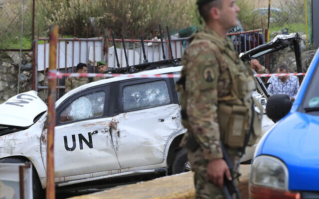 Lebanese soldiers stand next to a damaged UN peacekeeper vehicle at the scene where a UN peacekeeper convoy came under gunfire in the al-Aqbiya village, south Lebanon, December 15, 2022. (AP Photo/Mohammed Zaatari) Lebanese soldiers stand next to a damaged UN peacekeeper vehicle at the scene where a UN peacekeeper convoy came under gunfire in the al-Aqbiya village, south Lebanon, December 15, 2022. (AP Photo/Mohammed Zaatari)