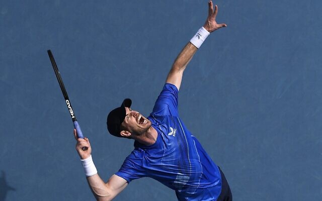 Andy Murray of Britain serves to Nikoloz Basilashvili of Georgia during their first round match at the Australian Open tennis championships in Melbourne, Australia, January 18, 2022. (Andy Brownbill/AP) Andy Murray of Britain serves to Nikoloz Basilashvili of Georgia during their first round match at the Australian Open tennis championships in Melbourne, Australia, January 18, 2022. (Andy Brownbill/AP)
