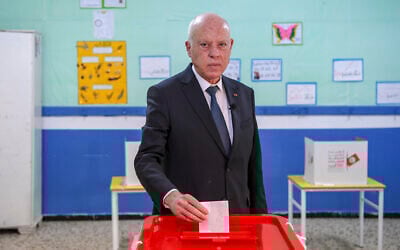 Tunisia's President Kais Saied casts his ballot as he participates in the legislative elections in Tunis, December 17, 2022. (AP/Slim Abid)