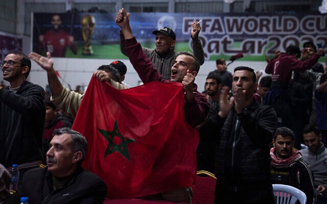 Palestinians react as they watch a live broadcast of the World Cup third-place playoff soccer match between Morocco and Croatia played in Qatar, in Gaza City, December 17, 2022. (AP Photo/Fatima Shbair) Palestinians react as they watch a live broadcast of the World Cup third-place playoff soccer match between Morocco and Croatia played in Qatar, in Gaza City, December 17, 2022. (AP Photo/Fatima Shbair)